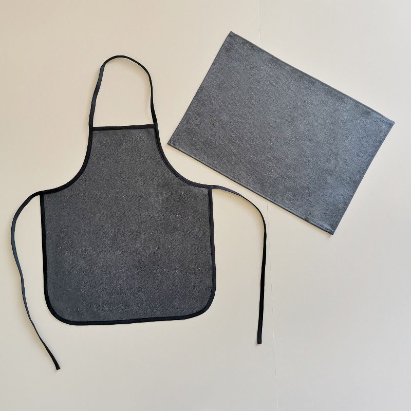 tapis et tablier déperlant et lavable en machine pour la maternelles ou les activités à la maison